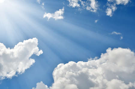 Blue sky with clouds and sunlight.