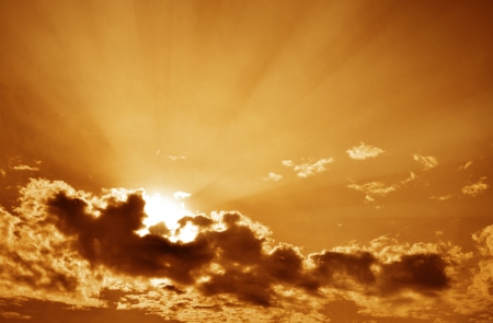 Sunset / sunrise with clouds, light and rays. の写真素材