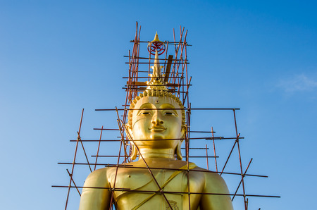 Buddha statue under construction at the temple of Thailand.の写真素材