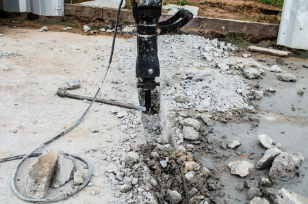 jackhammer has been drilled into the pavementの写真素材