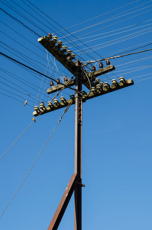 electricity post in blue sky の写真素材