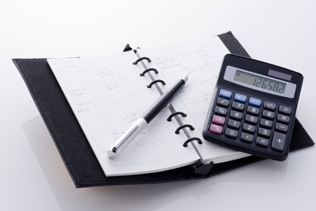 Notebook, pen and calculator for anlyzingの写真素材