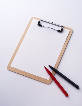 clipboard and pens on the white backgroundの写真素材