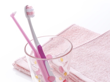 pink toothbrush in the glassの写真素材