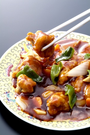 Chinese food is cooked with pork and vegetablesの写真素材