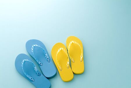 a pair of sandals on the blue backgroundの写真素材