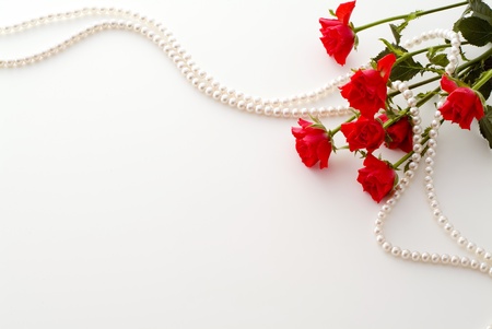 a background image of red roses and pearlの写真素材