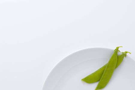 snow pea on white plate