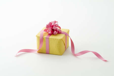 cute gift box with pink ribbonの写真素材