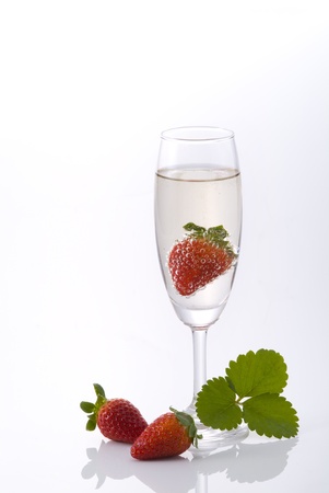 champagne and strawberry on white backgroundの写真素材