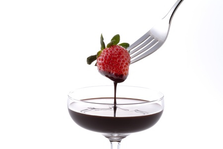 chocolate fondu with strawberry and cocktail glassの写真素材