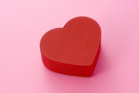 Isolated heart-shaped gift box の写真素材