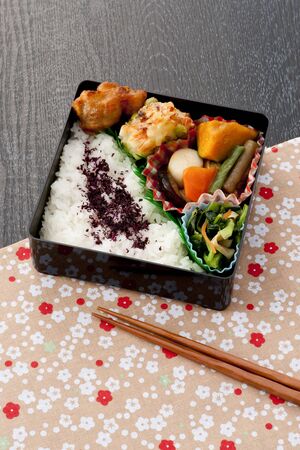 japanese lunch box on wooden blackの写真素材