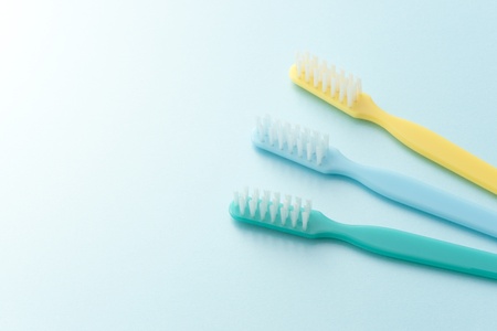 toothbrush on light blue backgroundの写真素材