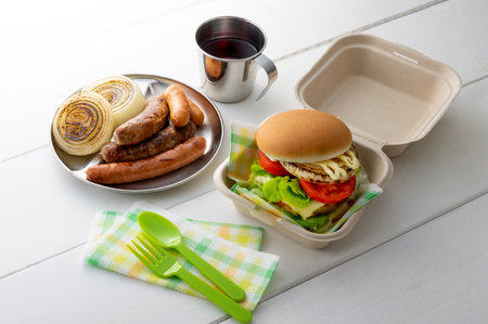 Hamburgers and sausages eaten at a picnicの写真素材
