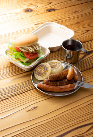 Hamburgers and sausages eaten at a picnicの写真素材