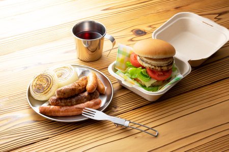 Hamburgers and sausages eaten at a picnicの写真素材