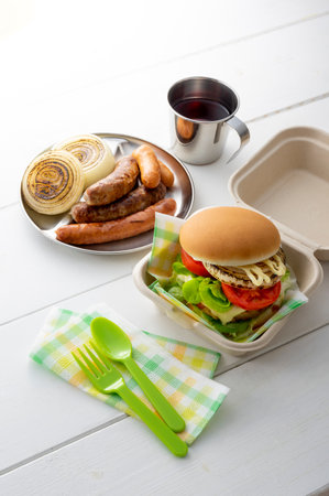 Hamburgers and sausages eaten at a picnicの写真素材