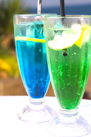 Two cocktails on table, sea backgroundの写真素材