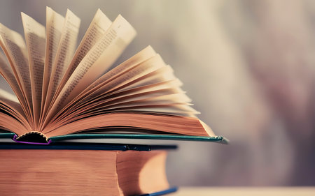 Book stack in the library and blurred bookshelf background for education. education background. back...