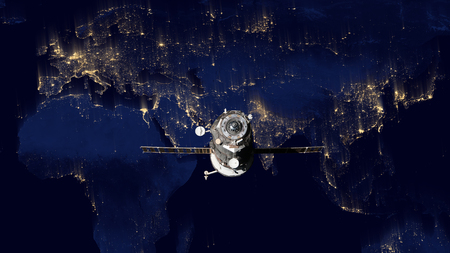 Spacecraft Progress orbiting the earthの写真素材
