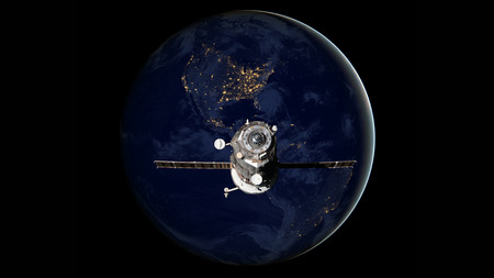 Spacecraft Progress orbiting the earth. Elements of this image furnished by NASA.の写真素材