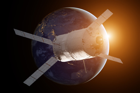 Cargo spacecraft - The Automated Transfer Vehicle over the planet Earth.の写真素材