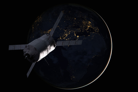 Cargo spacecraft - The Automated Transfer Vehicle over the planet Earth.の写真素材