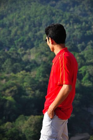 Man standing on top of a Mountain,  the north of Thailand の写真素材