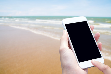 woman hand hold and touch screen smart phoneの写真素材