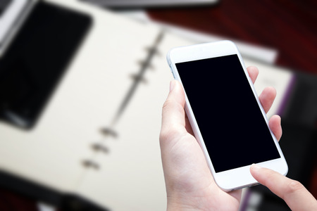 woman hand hold and touch screen smart phoneの写真素材