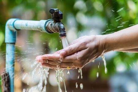 Water flowing from the valveの写真素材