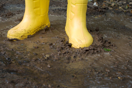 Farmer Boots in the soilの写真素材