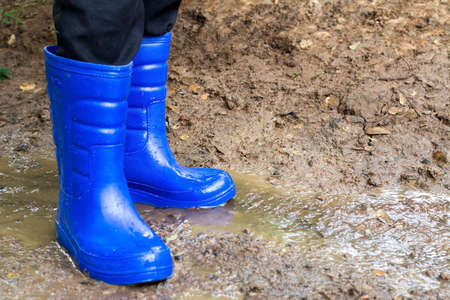 Farmer boots in the soilの写真素材