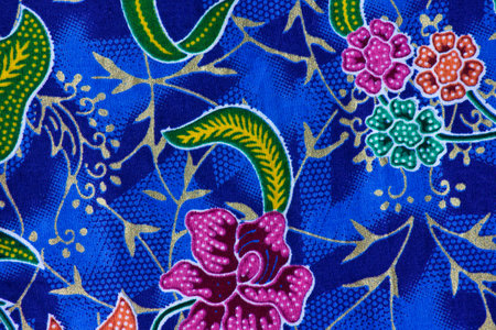 Texture, background. Fabric silk blue with a pattern of flowers and paisley