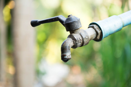 Water faucet in the garden, closeup of photo.の写真素材
