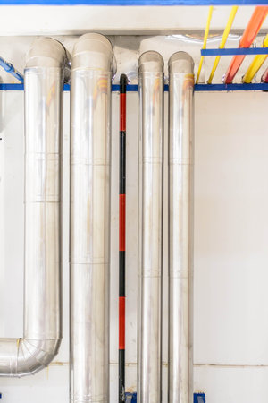 Plastic pipes in a boiler room, close-up of photoの写真素材