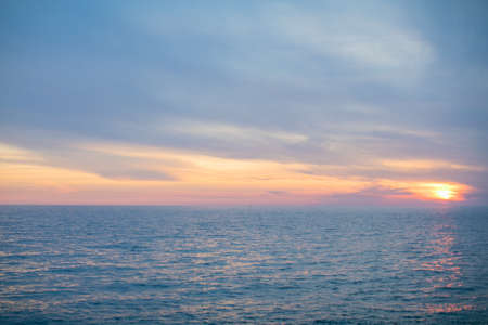Beautiful dramatic clouldy sky during sunset over the sea, natural background of clould sky