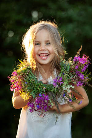 beautiful little girl in a wreath