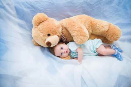 Portrait of cute baby girl with sparkling eyesの写真素材