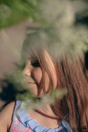 Close up portrait of little beautiful cutie princess girl with emotional faceの写真素材