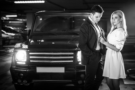 Sexy couple in the car. Hollywood stars. Fashionable lookの写真素材
