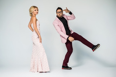 portrait of a young fashion couple looking into the cameraの写真素材