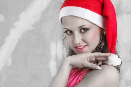 sexy girl with red hait wearing santa claus clothesの写真素材