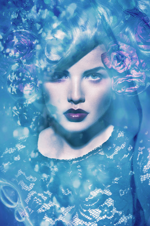 beautiful woman with flower in hairの写真素材
