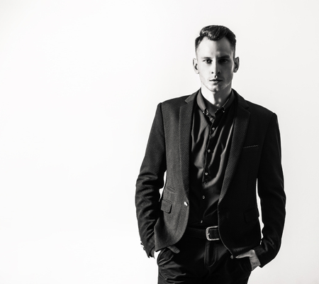 businessman with crossed arms pose against white backgroundの写真素材