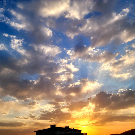 a dramatic beautiful sunset over field with dark clouds and clear light at summertime .beautiful bright perspective with clouds layers , Middle East, Kurdistanの写真素材