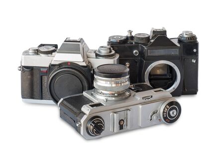 Old vintage black and silver cameras on a white background, isolatedの写真素材