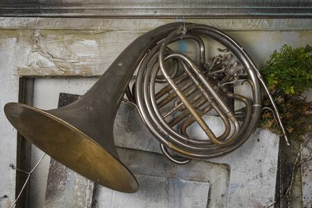 French horn hanging on top of the door