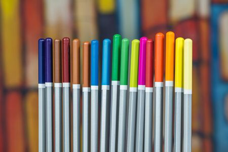Set of color drawing pencils with colorful background